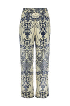 Patterned pants with blue floral design on a white background