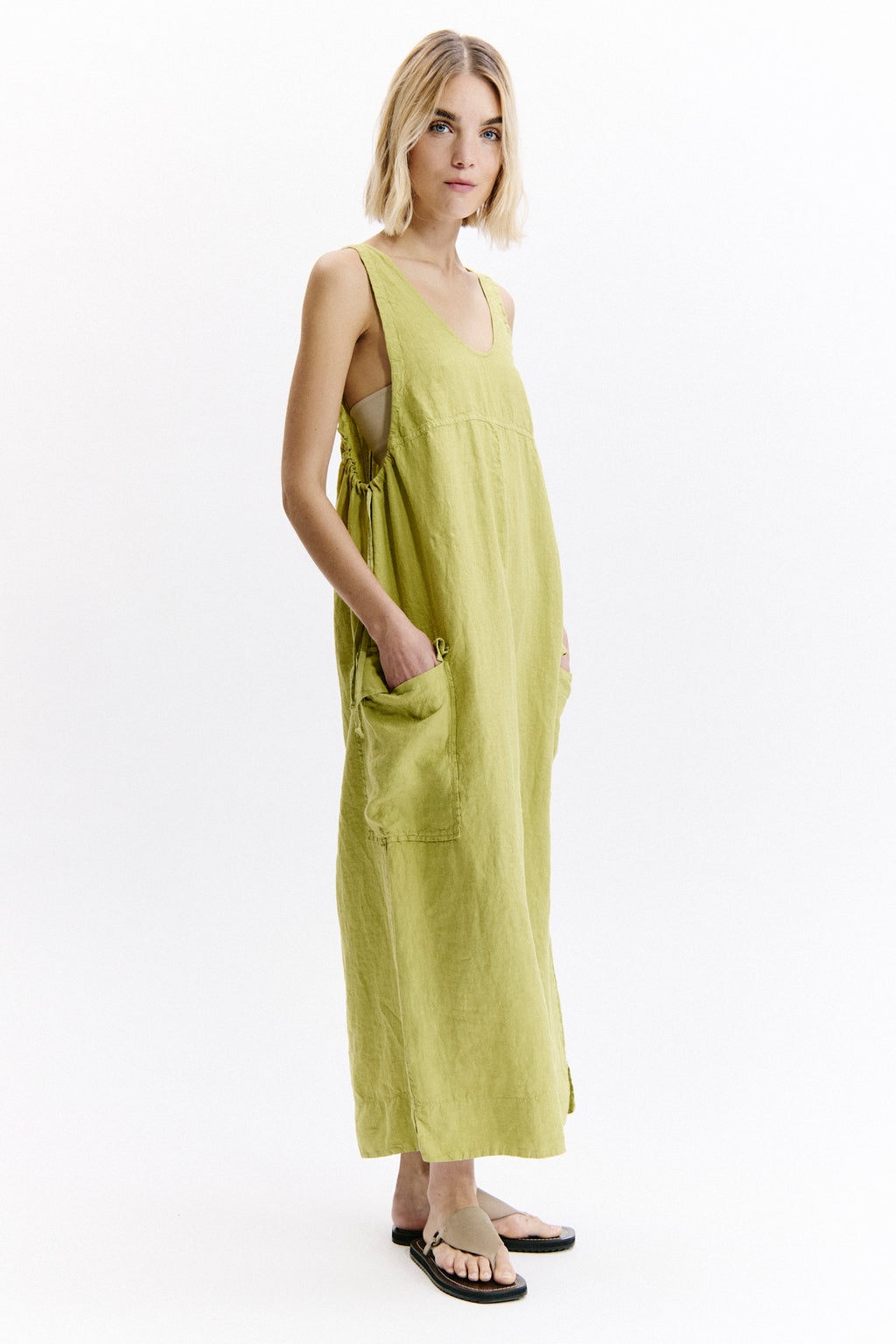 Woman wearing a light green dress on a white background