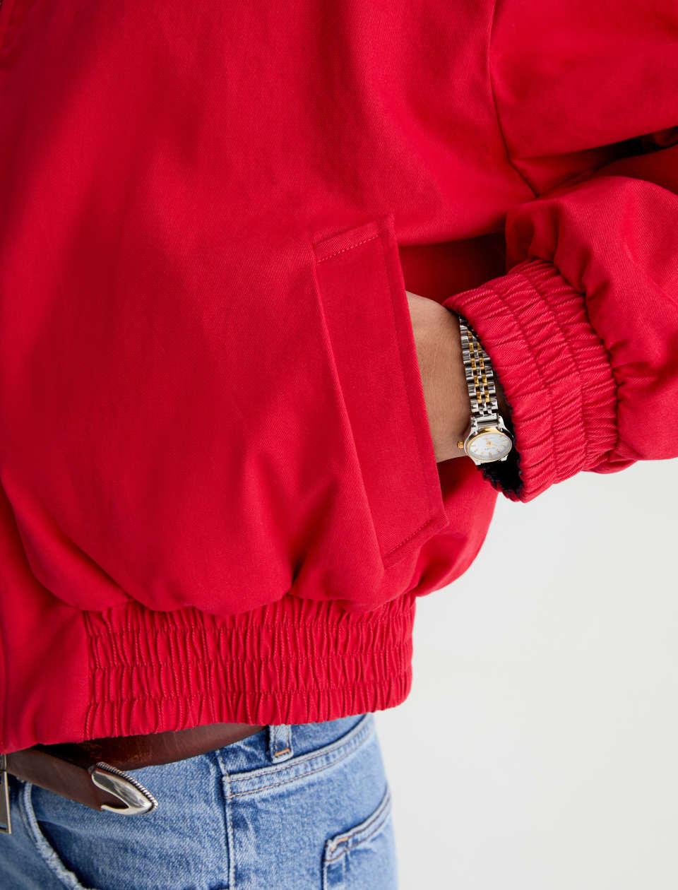 Red jacket worn by a person on a light gray background