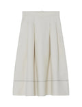 White skirt with a subtle pattern on a light gray background