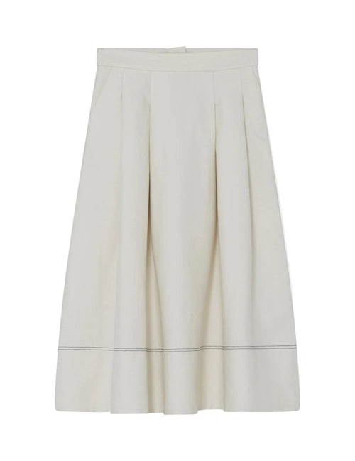 White skirt with a subtle pattern on a light gray background