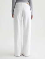 White pants worn by a person on a white background