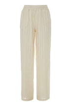Beige ribbed pants on a white background