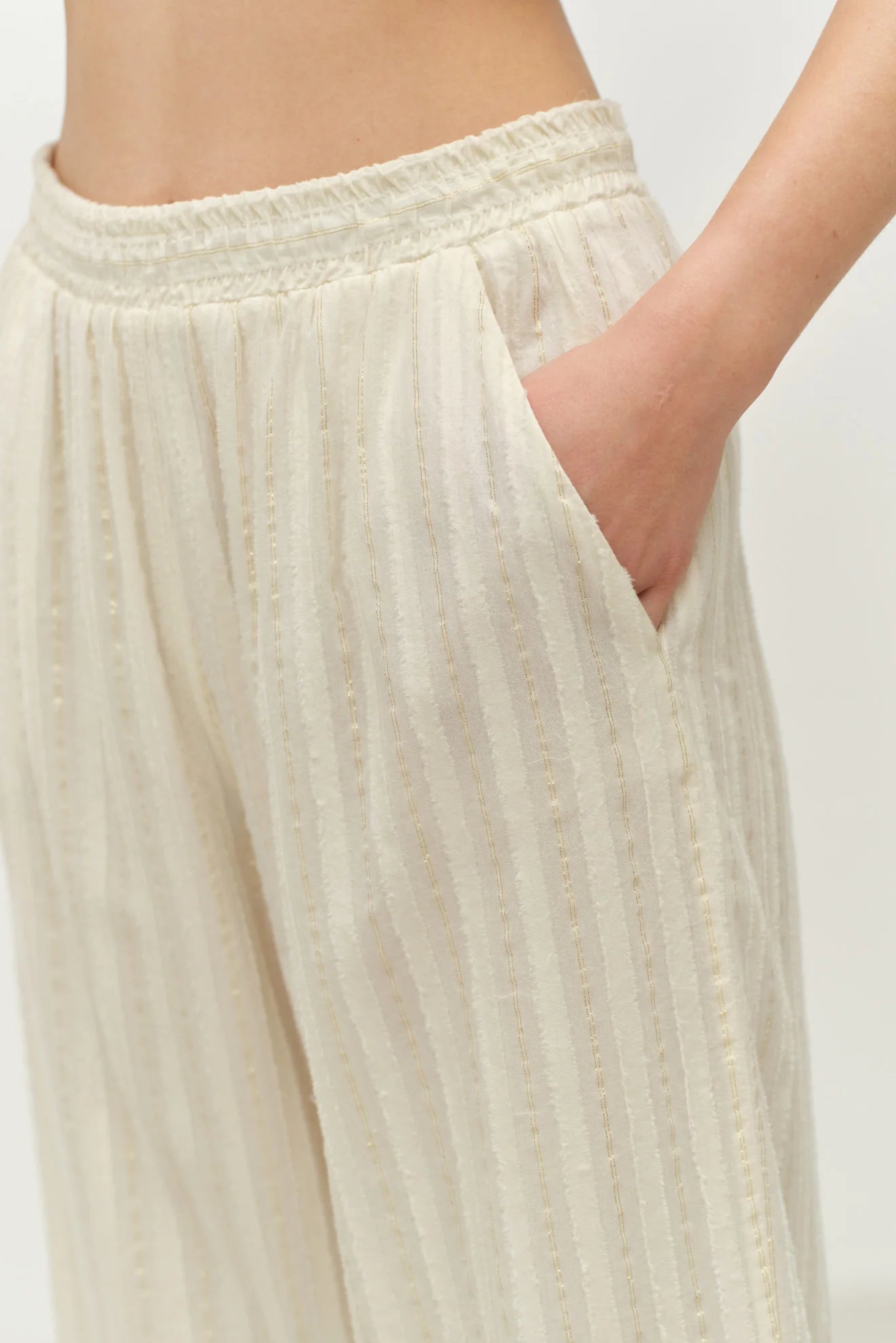 Beige pants with a plain background