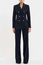 Navy blue suit with gold buttons on a white background