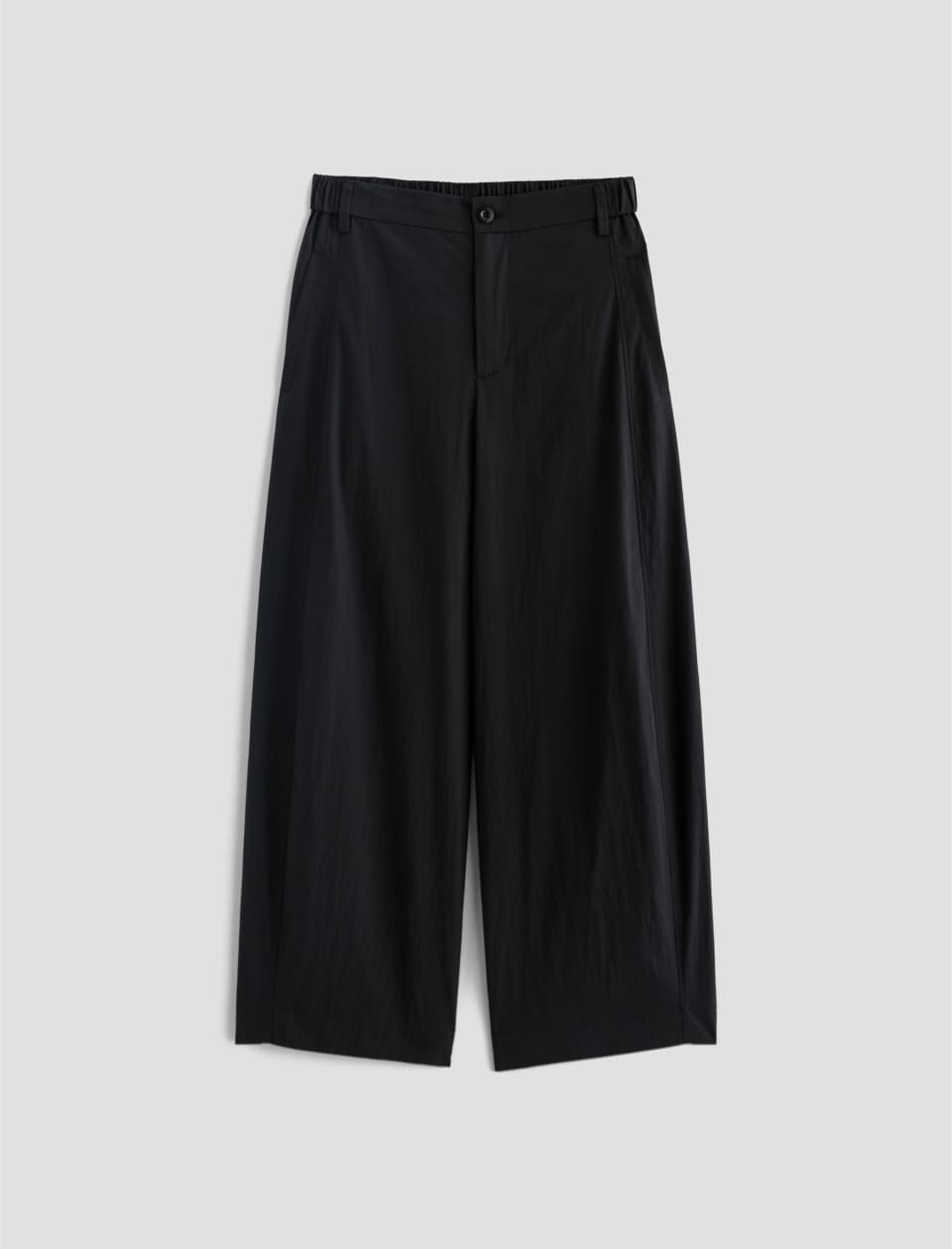 Black wide-leg pants on a light gray background