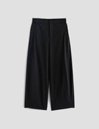Black wide-leg pants on a light gray background