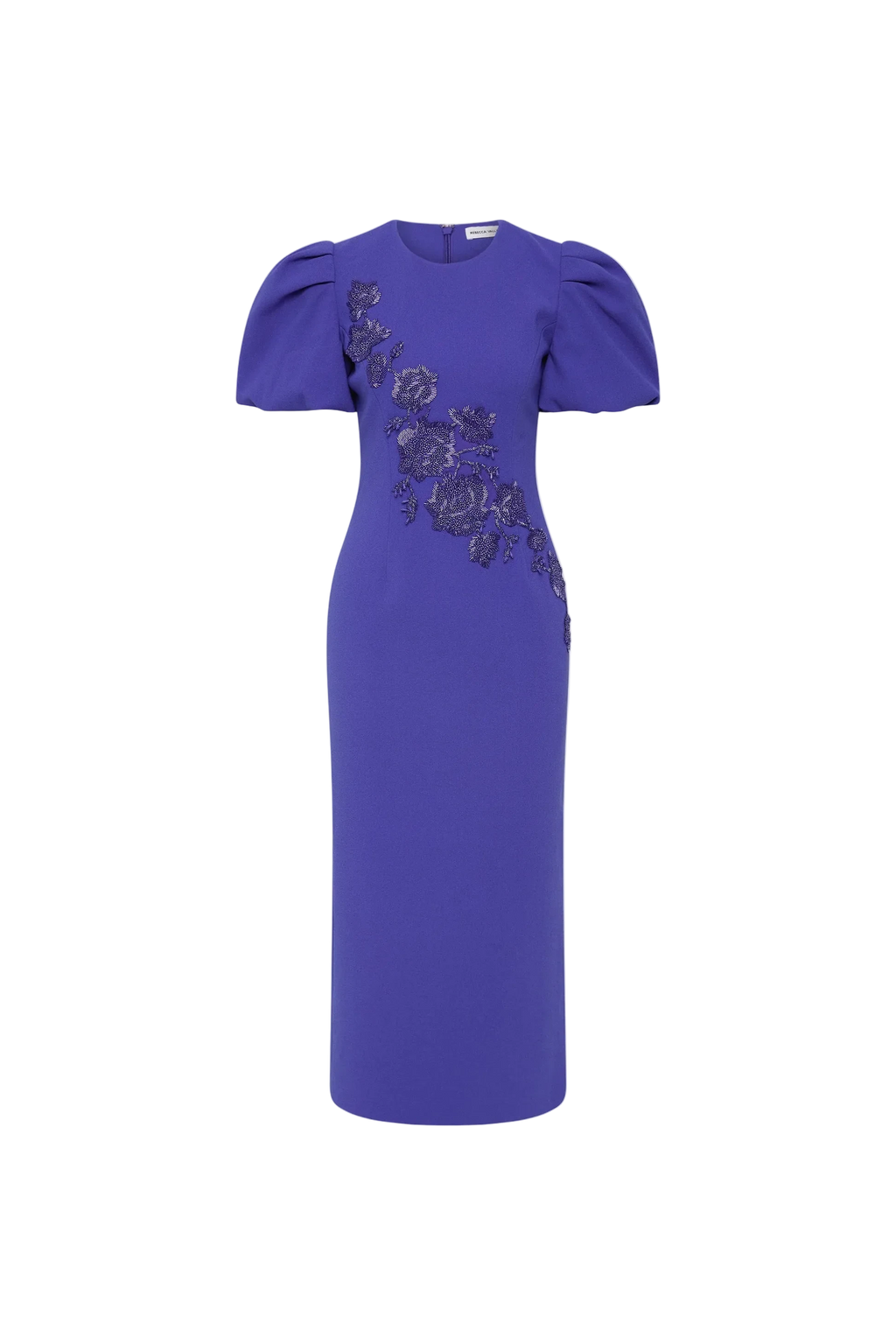 The Rebecca Vallance Evolet Puff Sleeve Midi Dress is captivating in a vibrant ultra marine blue, adorned with intricate floral embellishments. Tailored from bonded crepe, its crew neckline and voluminous short puff sleeves create a refined and elegant shape, complemented by a fitted bodice that flatters the figure. The pencil midi skirt creates an elegant silhouette, detailed with a back split for ease of movement. Secured with an invisible zip fastening at the back and lining for comfort, this dress is a 