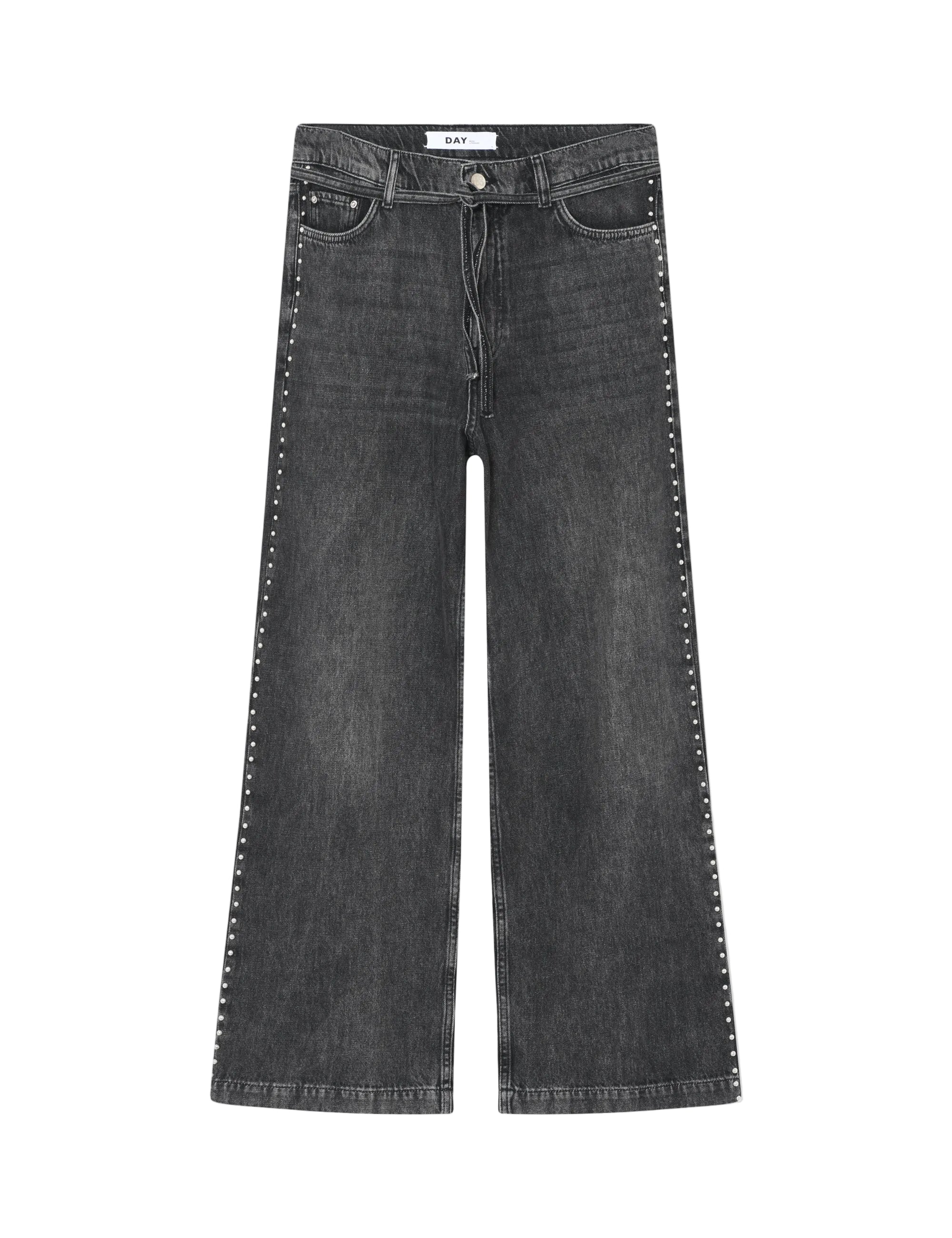 Black jeans with studded details on a white background