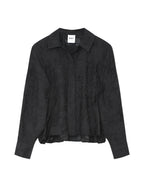 Black textured shirt on a light gray background
