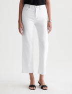 Person wearing white pants on a plain background