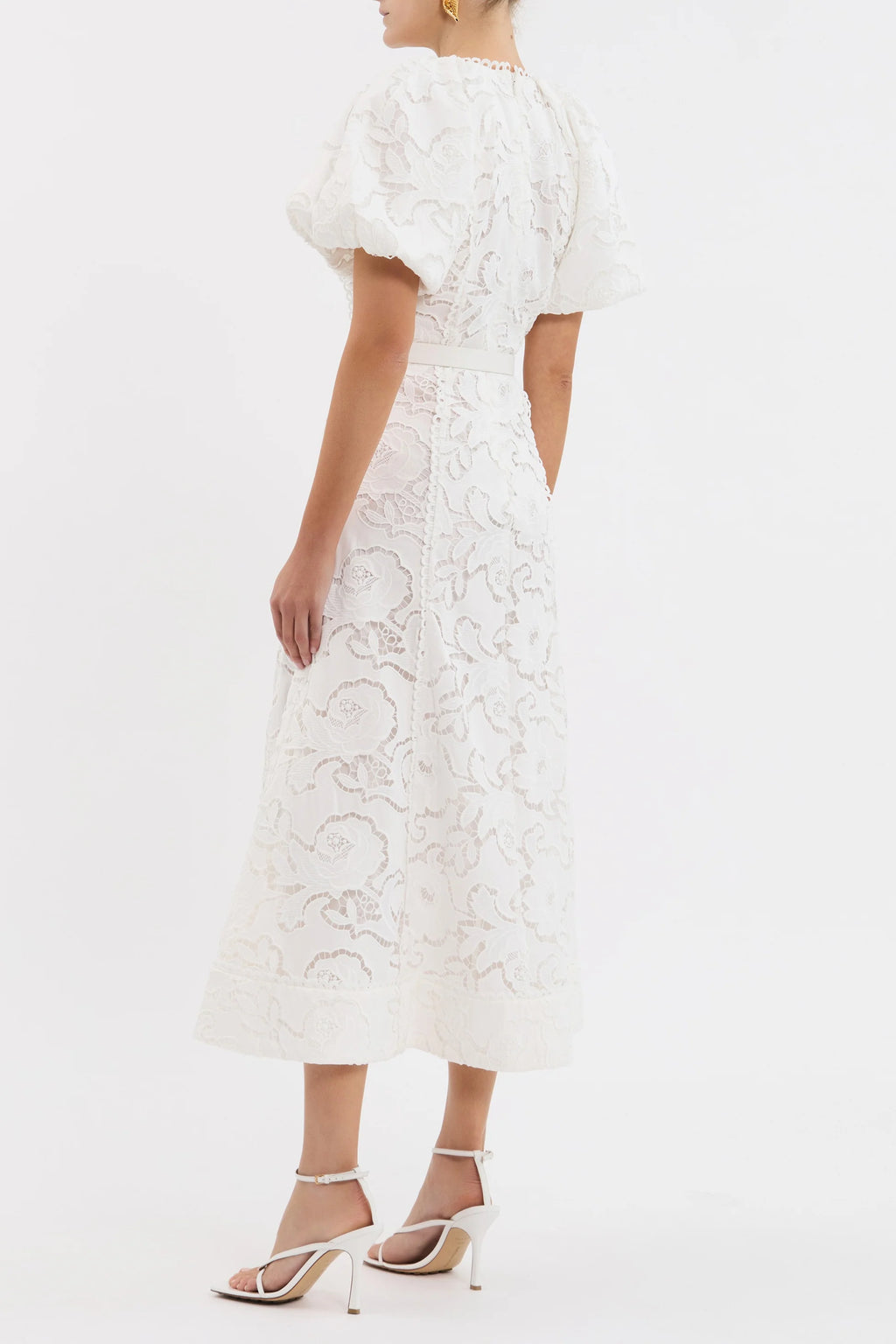 White lace dress with cut-out back on a white background