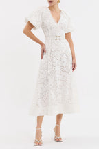 White lace dress with a belt on a white background