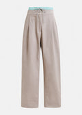 A pair of beige hip pants with a contrast elastic waistband and Nimbus Cloud pattern.