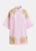 Pink shirt with gold floral patterns on a white background