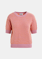 short-sleeve jacquard knit top in a mauve color with ribbed trims and contrasting orange dots,