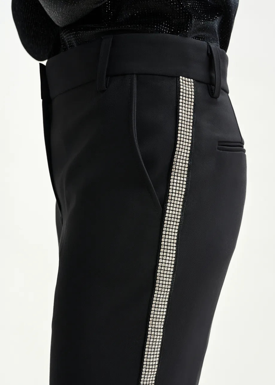 Black pants with a decorative white stripe on a white background