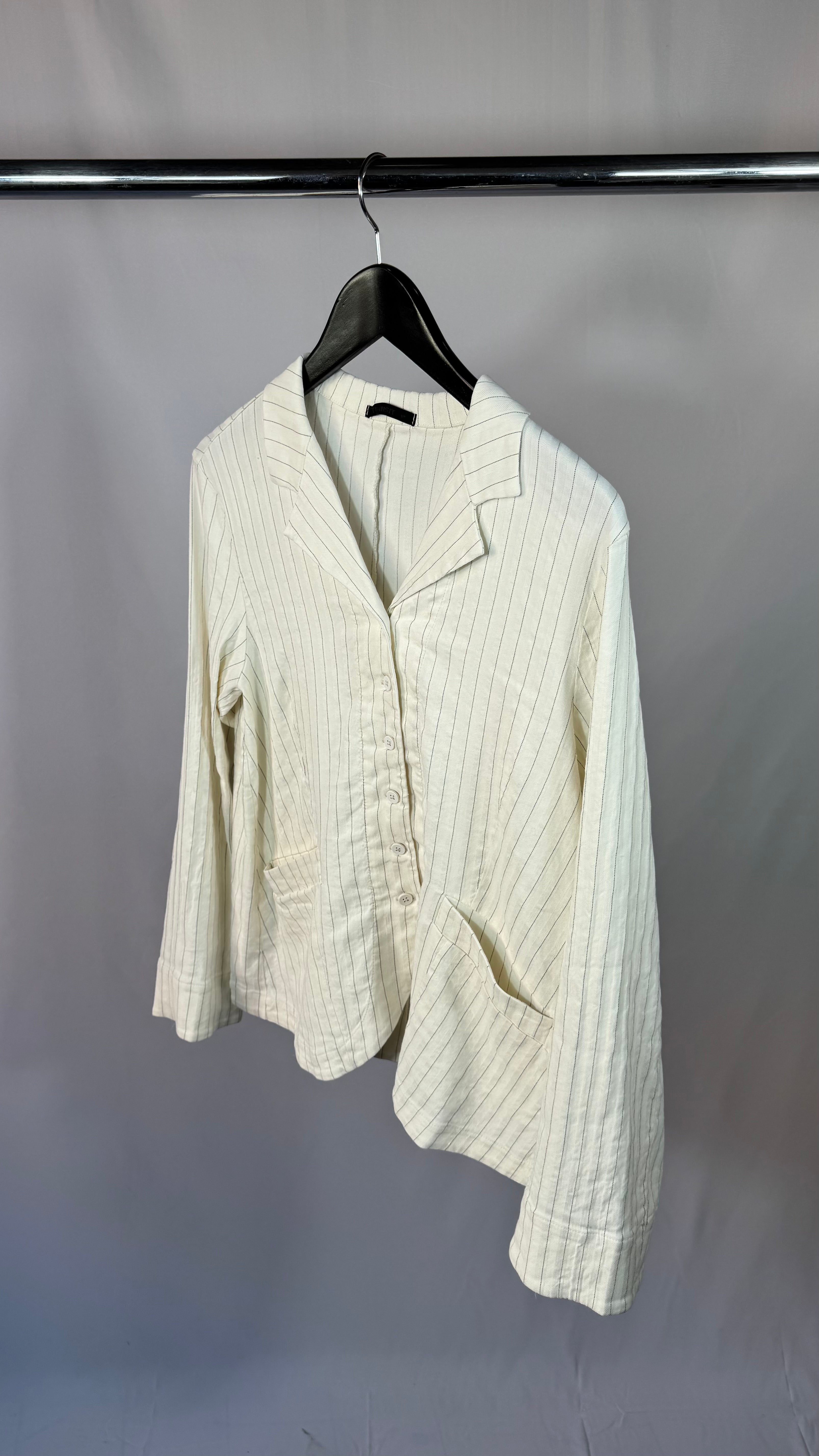 White ribbed knit cardigan on a hanger against a plain background