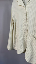 Light-colored striped shirt on a plain background