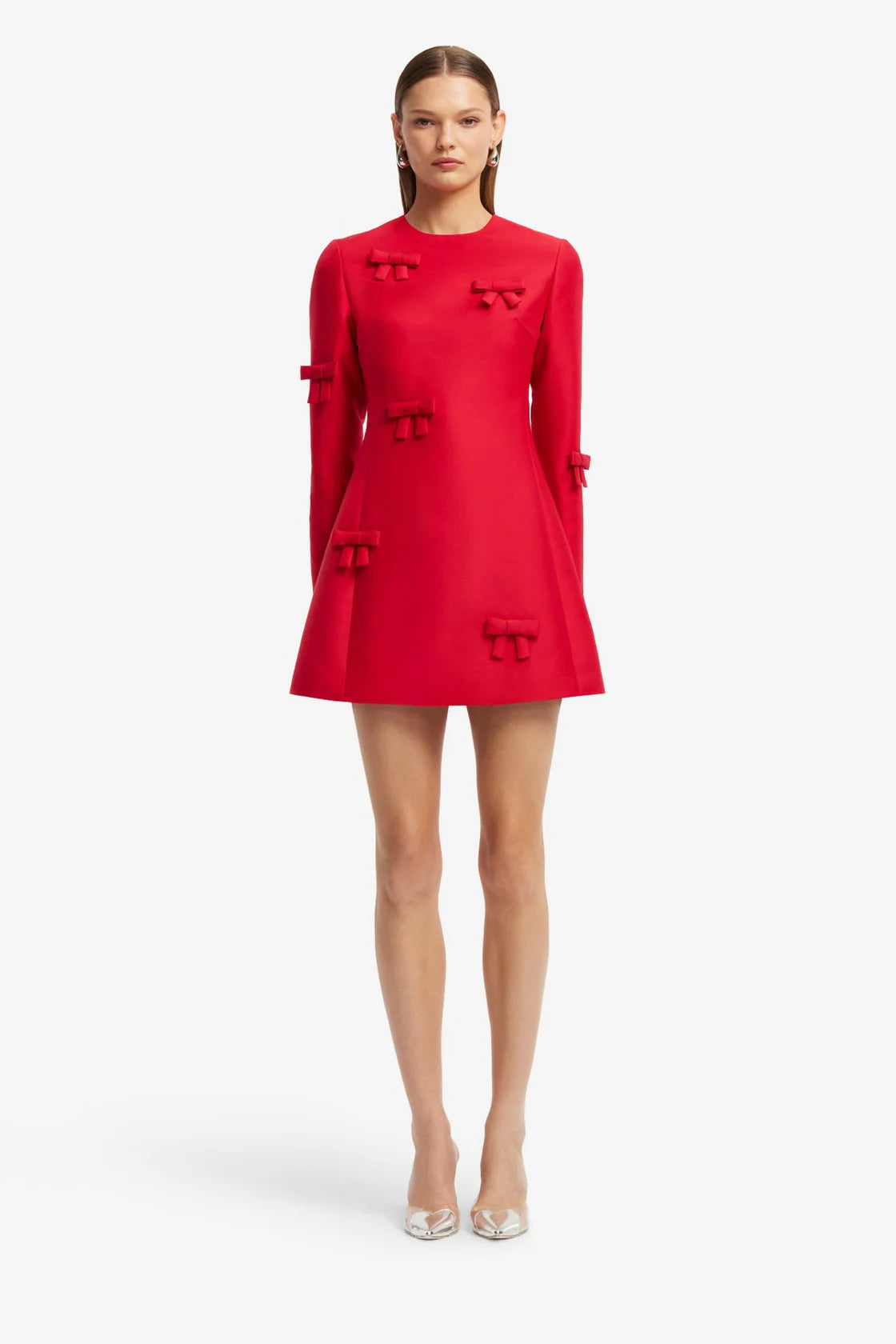 Red dress with decorative elements on a white background