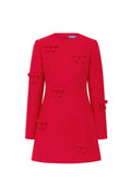 Red coat with bow details on a white background