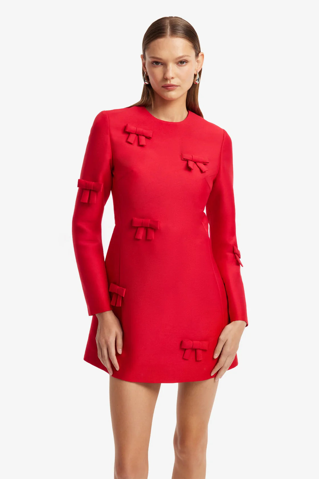Red dress with bow details on a white background