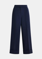 Navy blue wide-leg pants on a light gray background