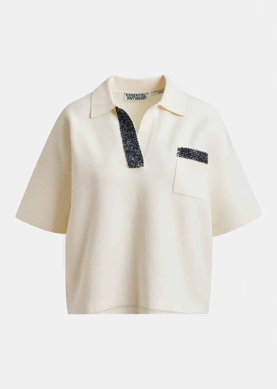 Beige polo shirt with black accents on a white background