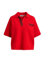 essentiel antwerp Red polo shirt with decorative trim on a white background