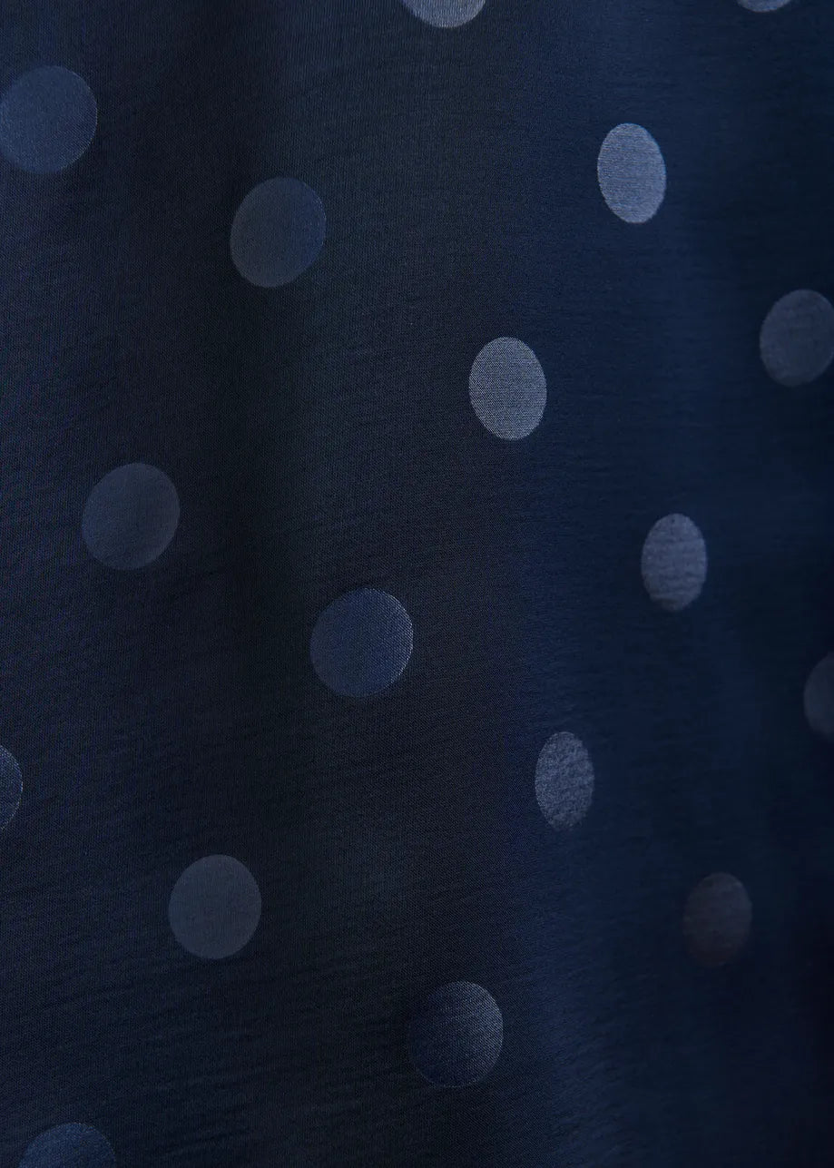 Navy blue fabric with light gray polka dots