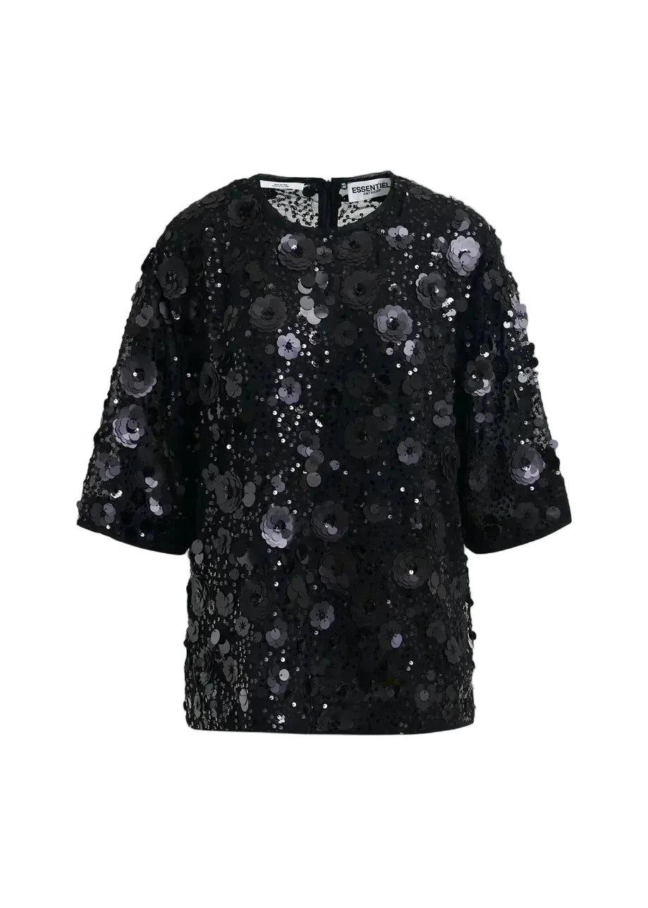 Black sequin dress on a light gray background