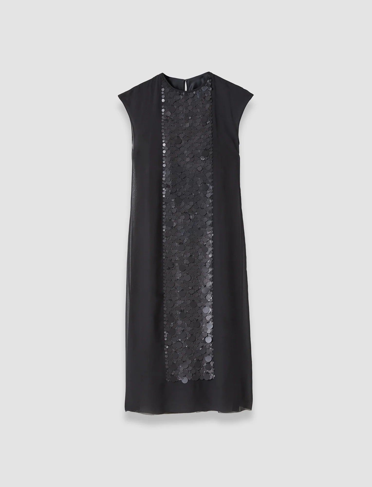 Black dress with sequin panel on a light gray background
