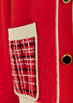 Red coat with a plaid patterned patch on a red background