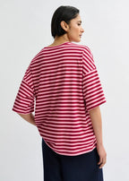 Person wearing a red and white striped shirt on a plain background