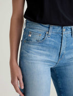 Close-up of blue jeans with a neutral background