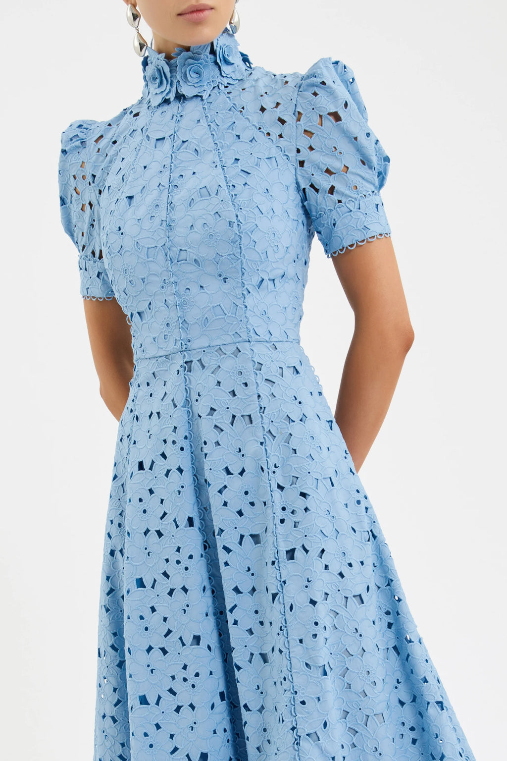 Light blue dress with black pattern on a white background
