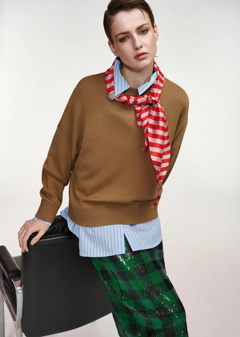 KURTIS-CC05

Essentiel Antwerp soft sweater spun from a wool-blend knit, designed in a relaxed silhouette with dropped shoulders and ribbed trims. The standout detail is the attached striped scarf finished with sparkling embellishments, adding a playful twist.