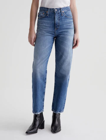 A pair of high-waisted, straight-leg blue jeans with a vintage-inspired fit, featuring a super-high waist and a roomy cut through the hips and legs, finishing at an ankle-skimming length.