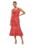 A woman wearing a sleeveless, round neckline, floral textured maxi dress with an invisible side zip closure.