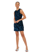 A model wearing a midnight blue sequin mini dress with a high scoop neckline and sleeveless design.