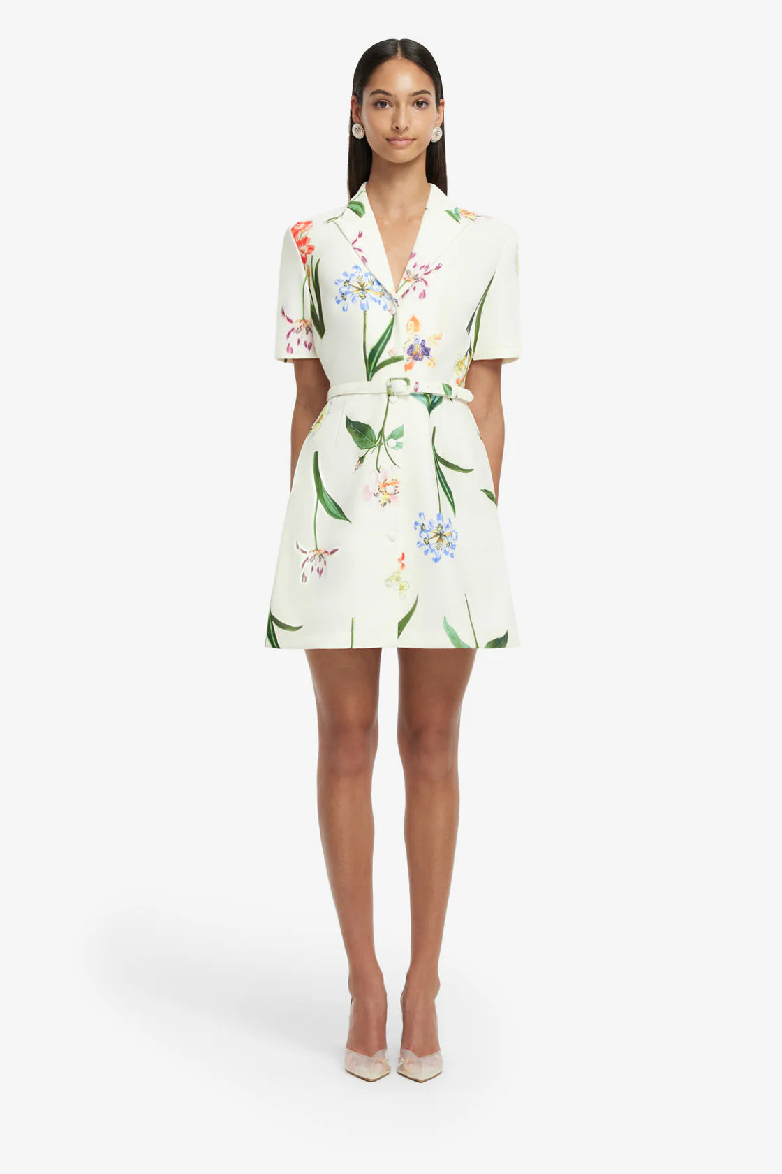 Woman wearing a floral dress on a white background