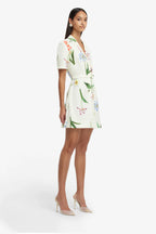 Woman wearing a floral dress on a white background