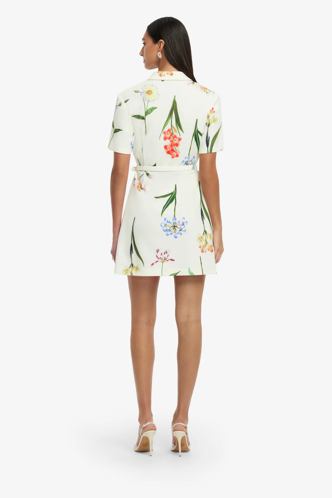 Woman wearing a floral dress on a white background