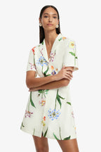 Woman wearing a floral dress on a white background