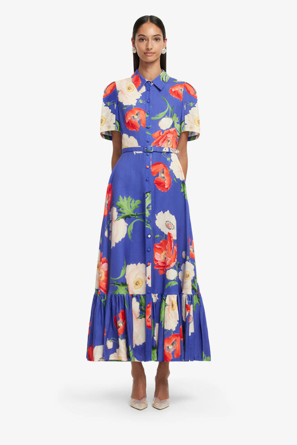 Woman wearing a colorful floral dress on a white background