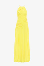 Yellow halter neck dress on a white background