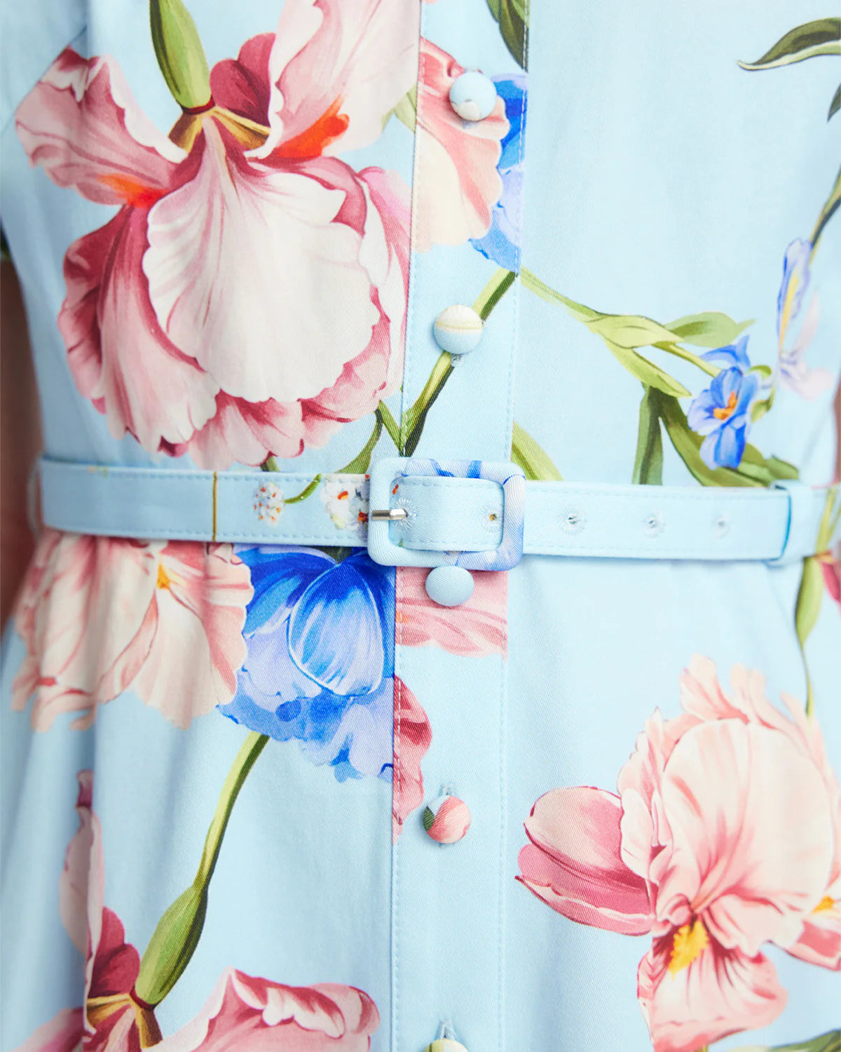 Floral dress with a belt on a light blue background