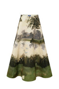 A high-waisted A-line midi skirt featuring a scenic landscape print of a lake, trees, and grassy fields in muted green, brown, and beige tones, shown against a plain white background.
