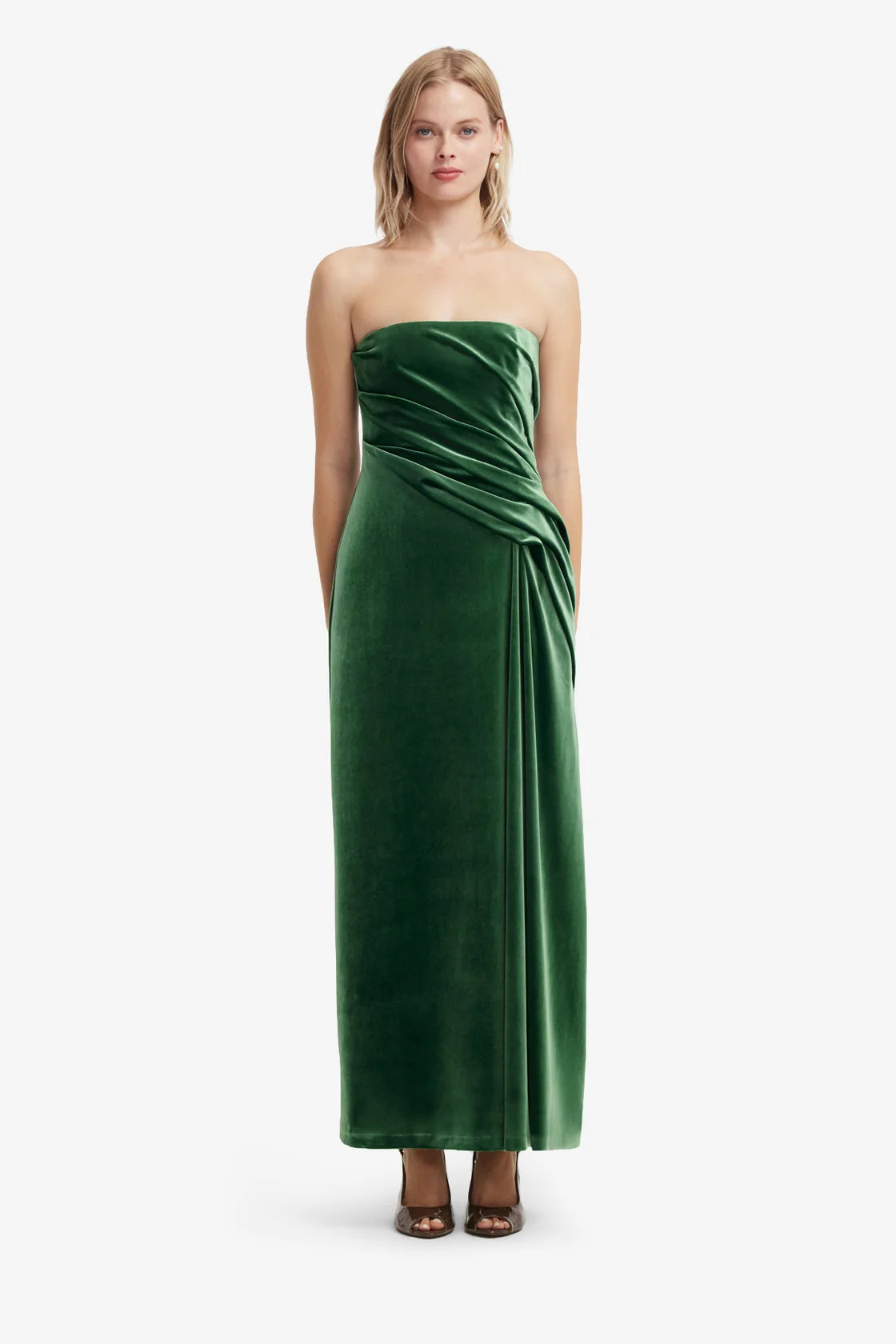 Woman wearing a green strapless gown on a white background