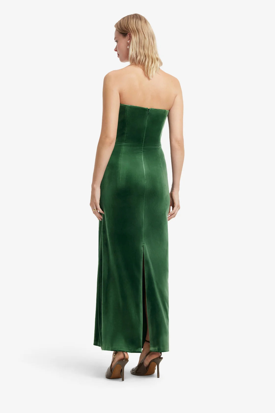 Woman wearing a green strapless gown on a white background